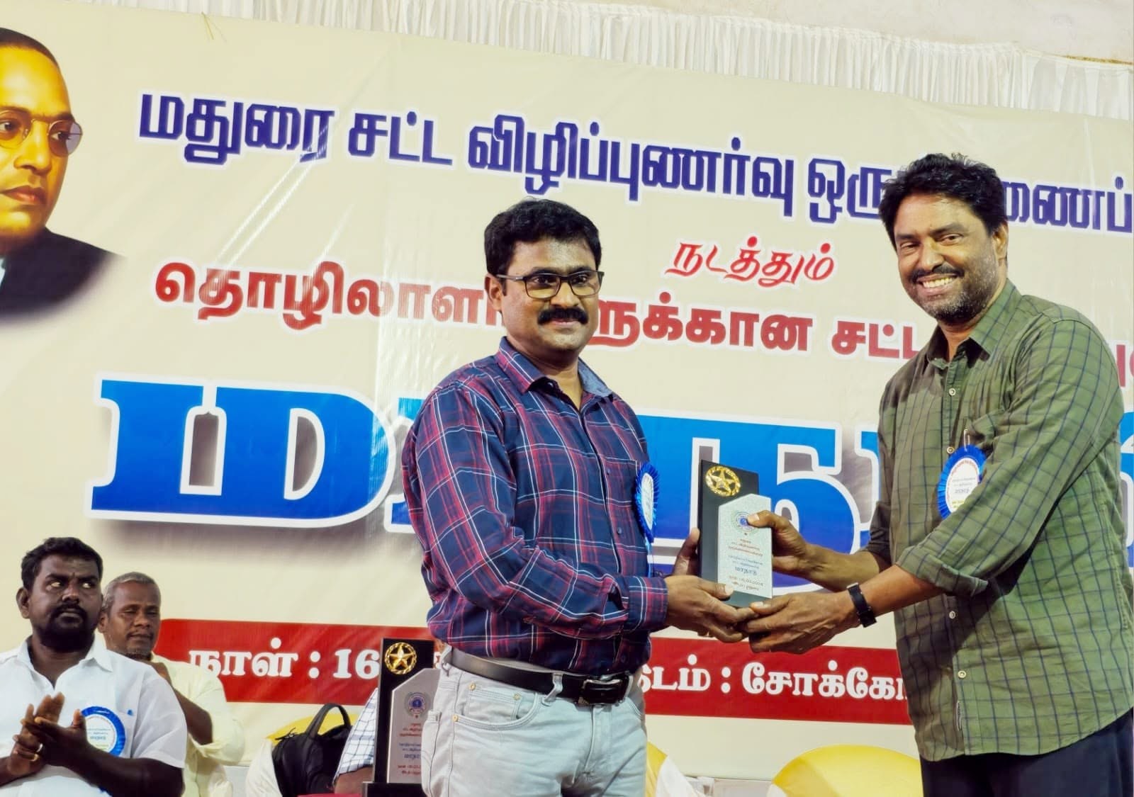 Award presentation at a legal awareness event
